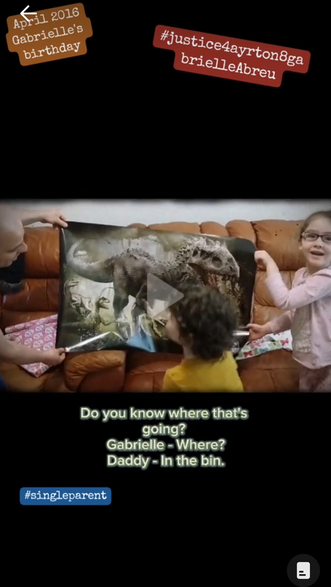 April 2016, photo of Ayrton & Gabrielle Abreu holding a Indominus rex poster Gabrielle was gifted for her birthday by daddy, at their home with daddy in Grimsby. Click to watch full clip