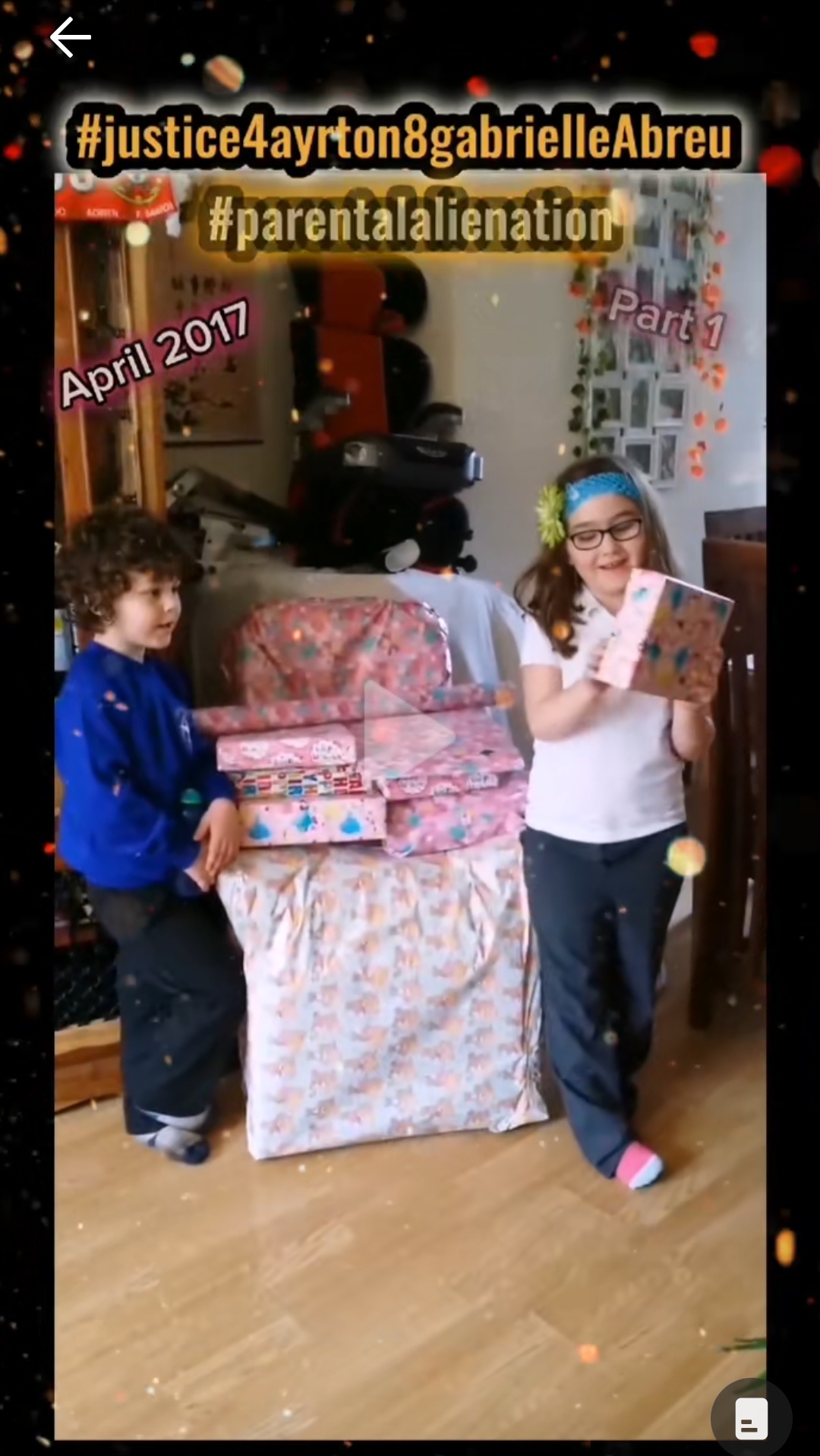 April 2017, photo of Ayrton & Gabrielle Abreu opening presents for her birthday at daddy's house. There is a huge birthday present next to them, nearly as tall as them. Click to watch full clip.