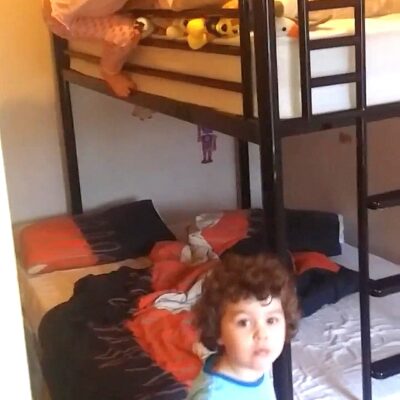 January 2016, photo of Ayrton & Gabrielle Abreu climbing up & over their high sleeper bed at their home with daddy. This photo is part of a group that will help provide some perspective to layout & dimensions for their living room. This photo faces the back wall of the bedroom. Click on it to expand.