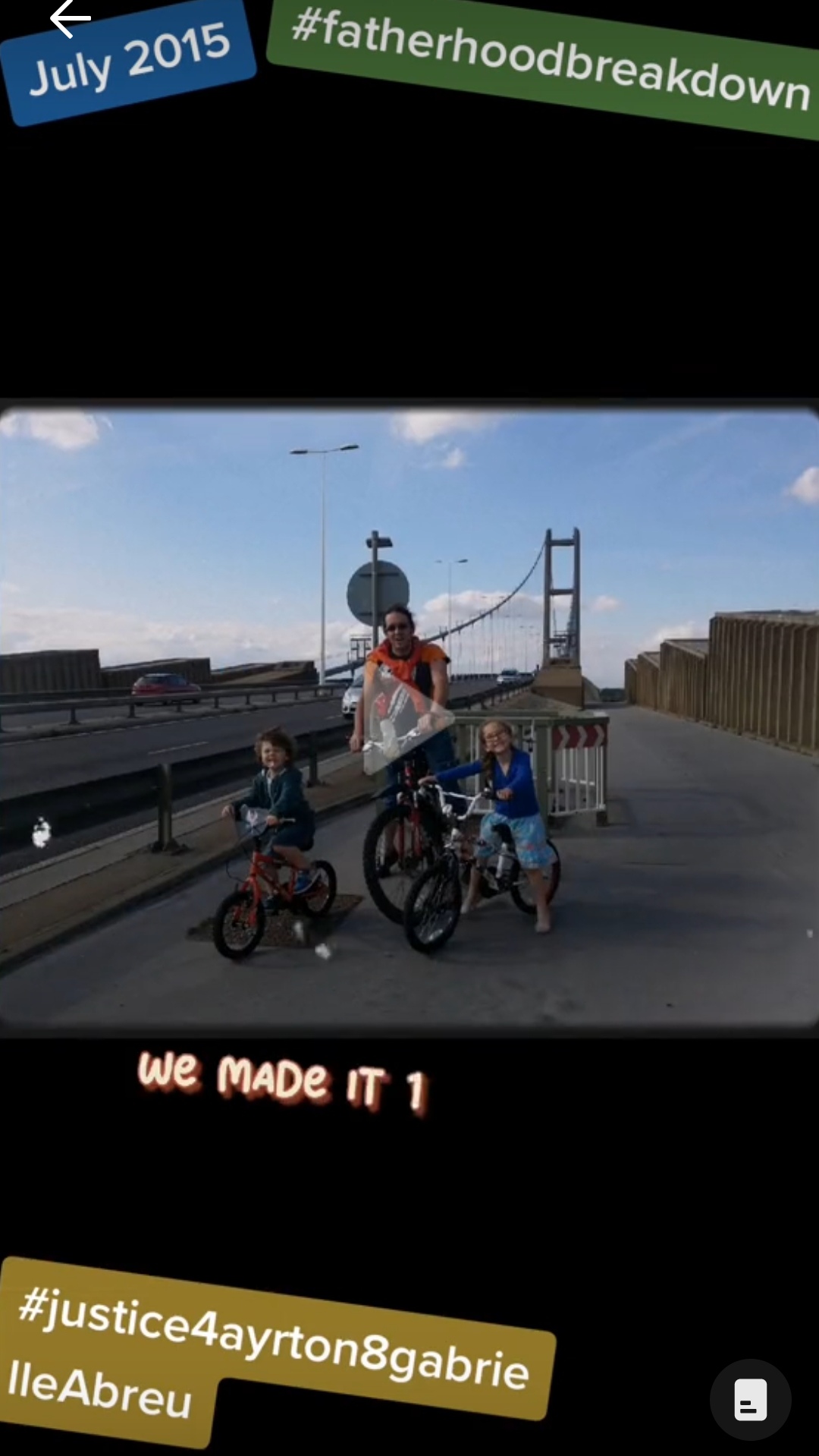 July 2015, photo of Ayrton & Gabrielle Abreu with daddy on their bicycles at the end of the Humber bridge over river Humber, after crossing it 1 way at the end of a sunny day. Click to watch full clip