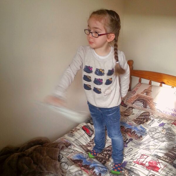 March 2015, photo of Gabrielle Abreu shaking Wii remote whilst standing on daddy's bed, in daddy's room in a shared house in Grimsby, facing back wall of daddy's room in shared house. Click to expand