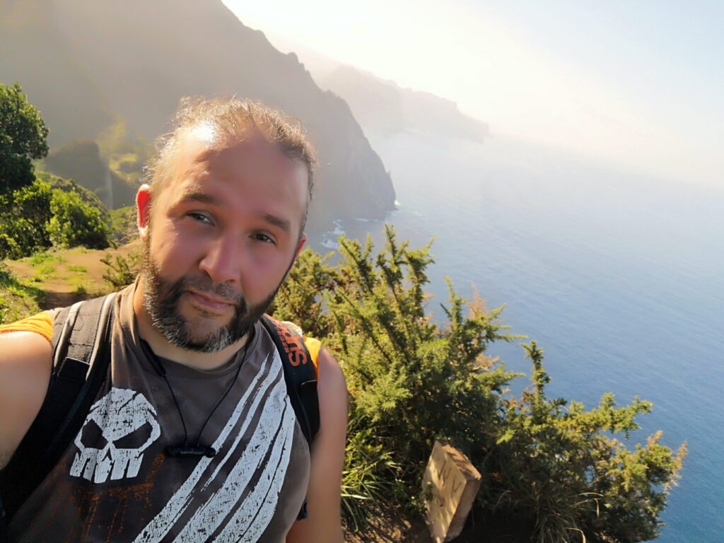 October 2023 photo of author Juan Abreu standing close to the edge of a cliff on the north east coast of Madeira island