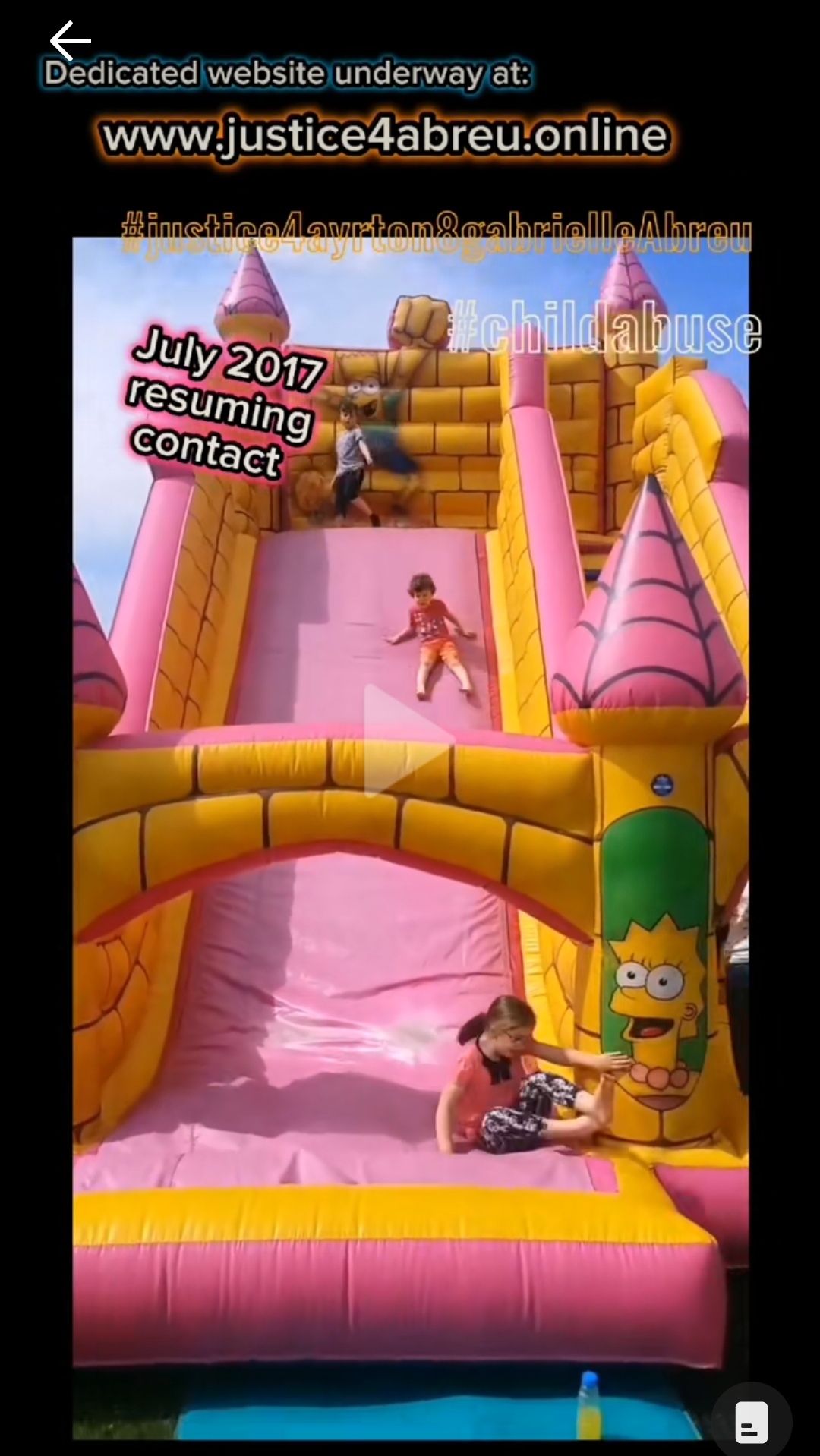 2017-07-16 photo of Ayrton & Gabrielle Abreu sliding down a rather big inflatable slide in Cleethorpes, in a sunny day. This was the first time they had contact with daddy since May 2017. This photo is linked to its clip